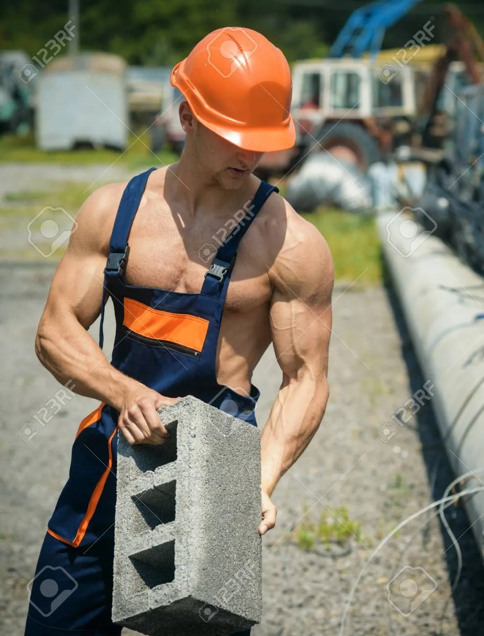 105919299-sexy-builder-concept-man-or-bodybuilder-with-big-muscles-guy-works-at-construction-...webp