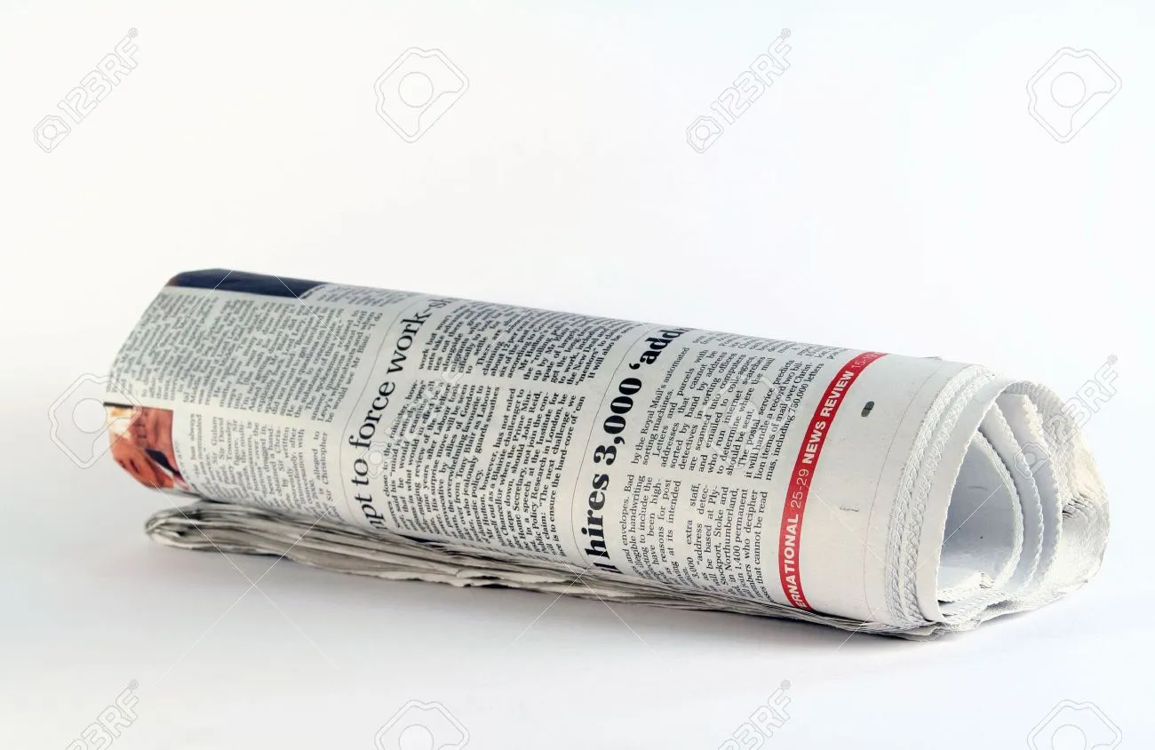 691916-A-rolled-up-newspaper--Stock-Photo-newspaper-roll.webp