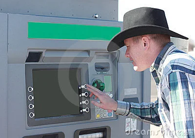 cowboy-using-atm-machine-23513555.webp