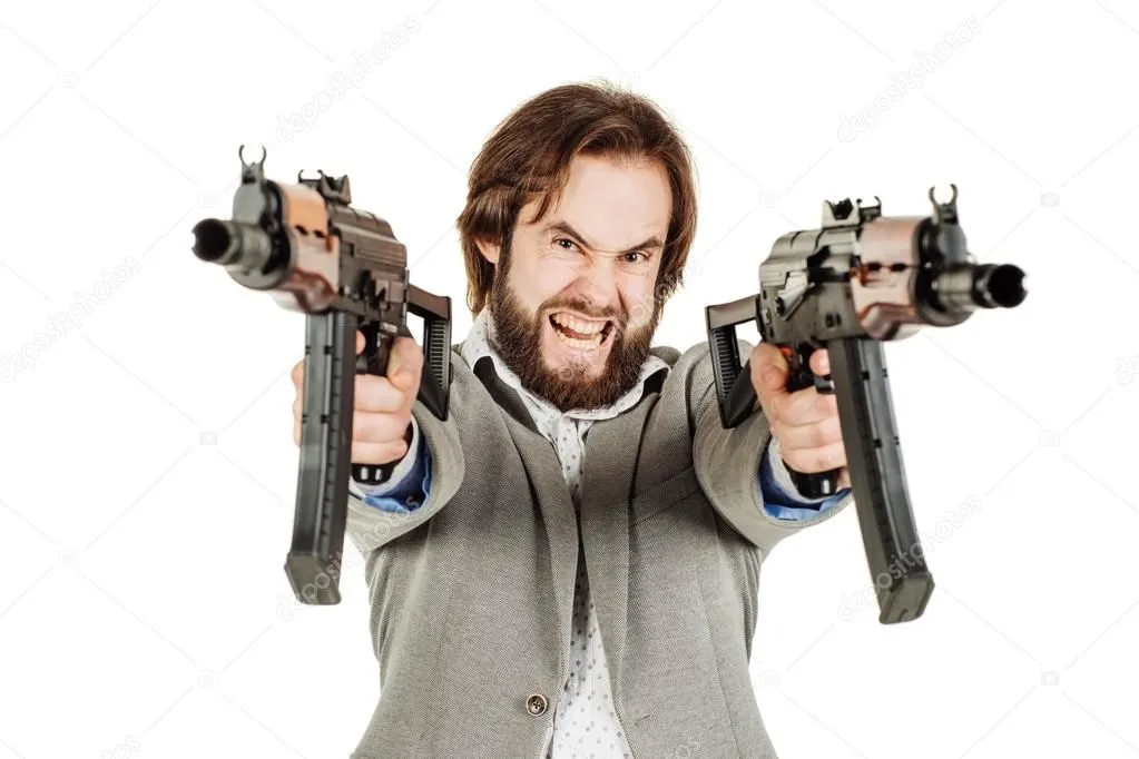 depositphotos_110420836-stock-photo-man-holding-a-machine-guns.webp