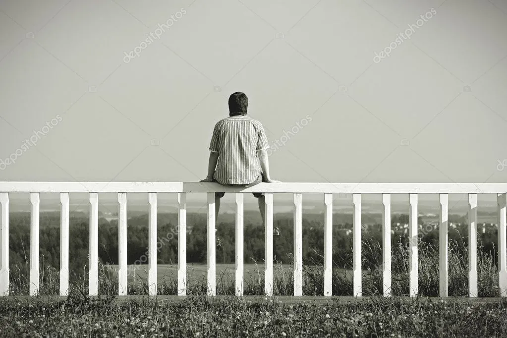 depositphotos_7864119-stock-photo-man-sitting-on-a-fence.webp