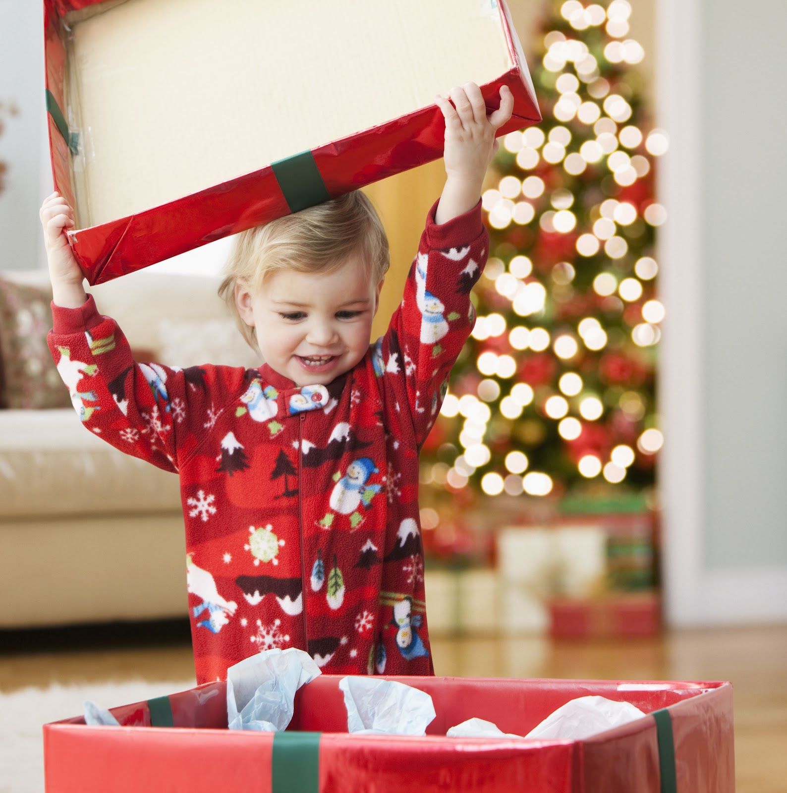 kid-happily-open-the-Christmas-gift.jpg