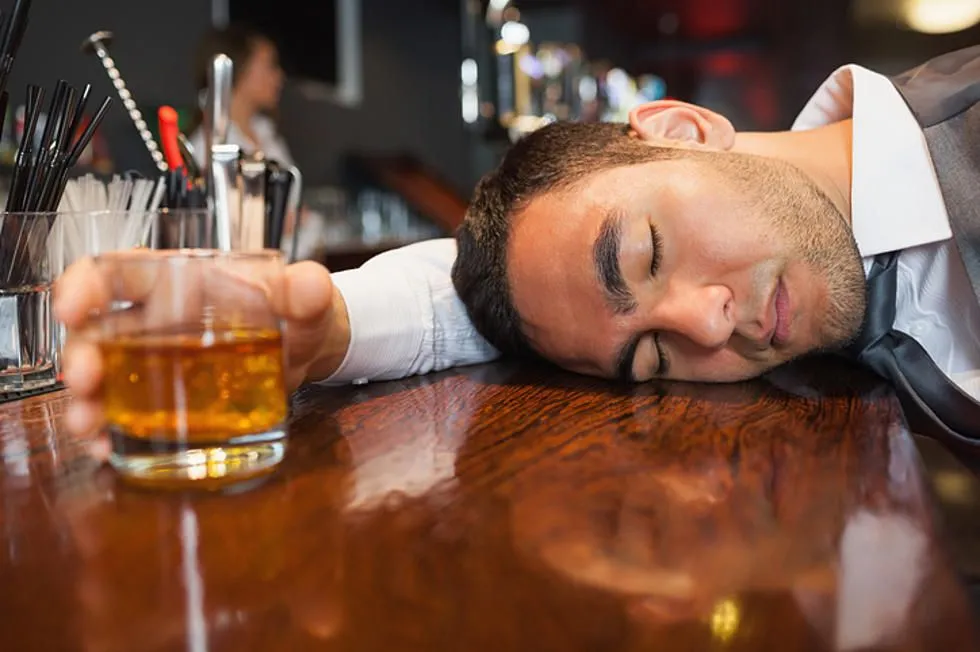 Passed-Out-At-Bar.webp