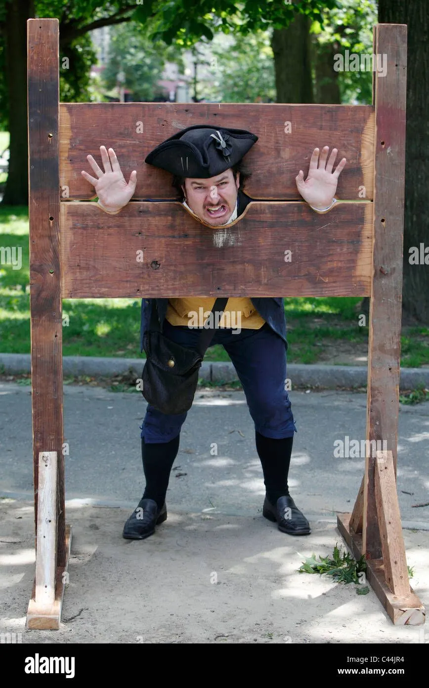 reenactment-a-man-in-colonial-era-dress-in-stocks-on-boston-common-C44JR4.webp