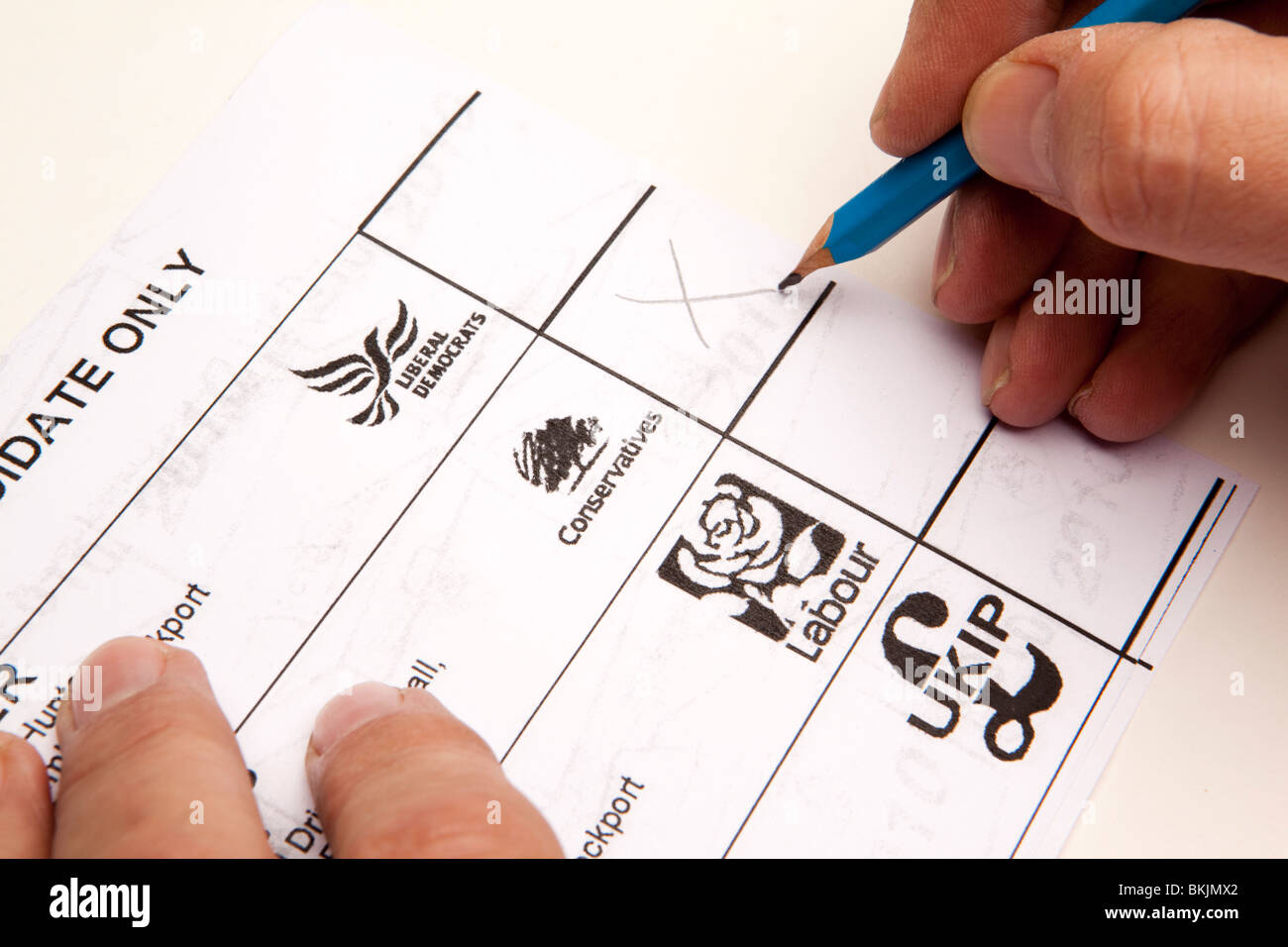 uk-elections-man-voting-on-ballot-paper-for-conservative-candidate-BKJMX2.jpg