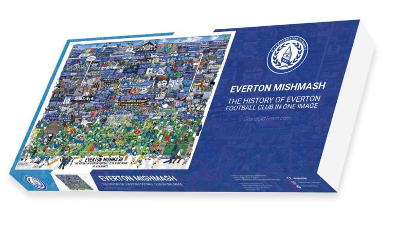 The image shows the front of a jigsaw puzzle box for "Everton Mishmash: The History of Everton Football Club in One Image". The box features a vibrant and detailed illustration dominated by blue and green colors, depicting various scenes, players, and elements related to Everton FC. The design includes the club's logo, a laurel wreath with a sailing ship, and the text "It's A Grand Old Team To Support" and "GrandOldTeam.com." The box highlights that the puzzle captures the history of the Everton Football Club in a single image. Additional details on the box include a smaller image of the completed puzzle, the artist's name (Alex Bennett), and various legal and copyright notices, including a CE marking and warnings about small parts. The background of the box is predominantly blue, with white and green accents.